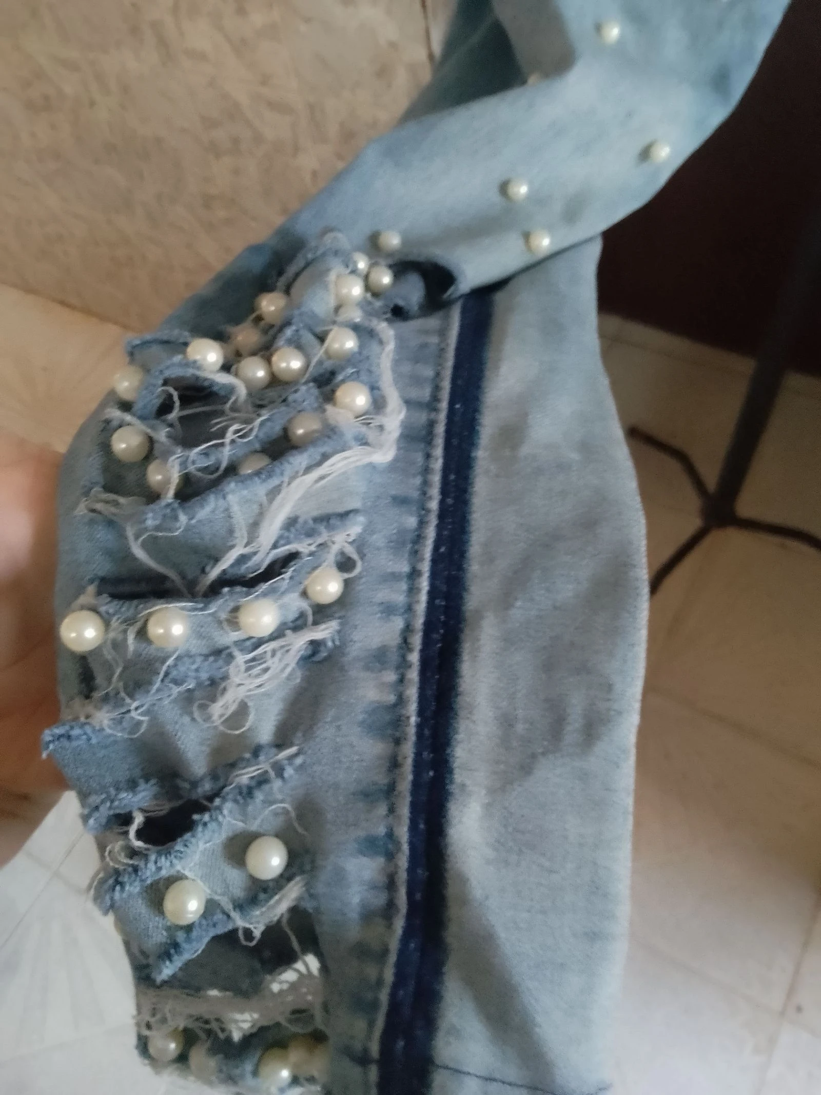 Denim pants with openings and balls – photo 5